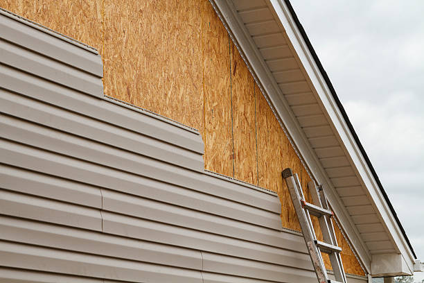 Professional Siding Installation technician working in Aurora, CO